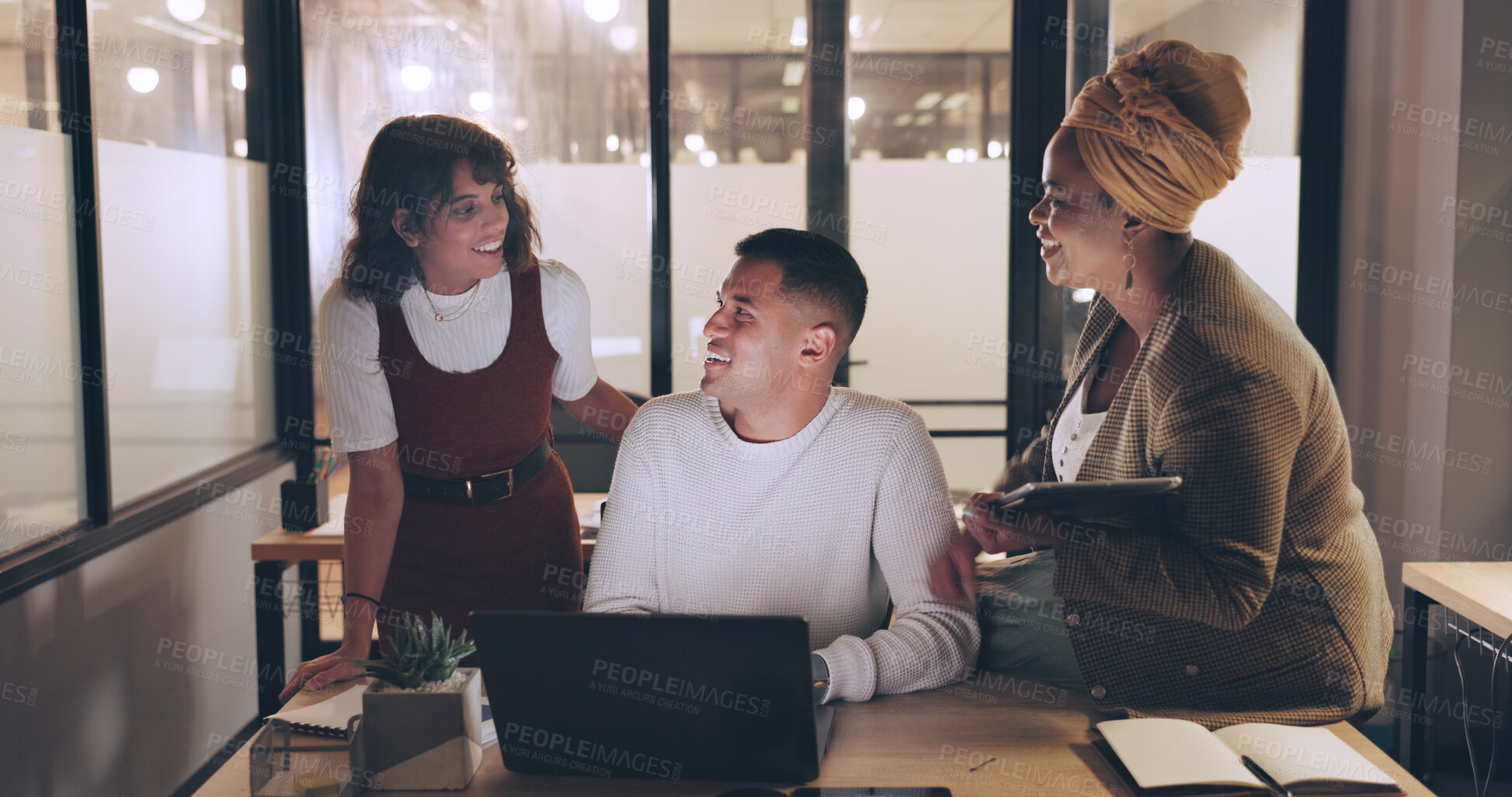 Buy stock photo Night collaboration, laptop and happy business people listening to project ideas, social media plan or funny joke. Group cooperation, dark office and professional team working late on research report