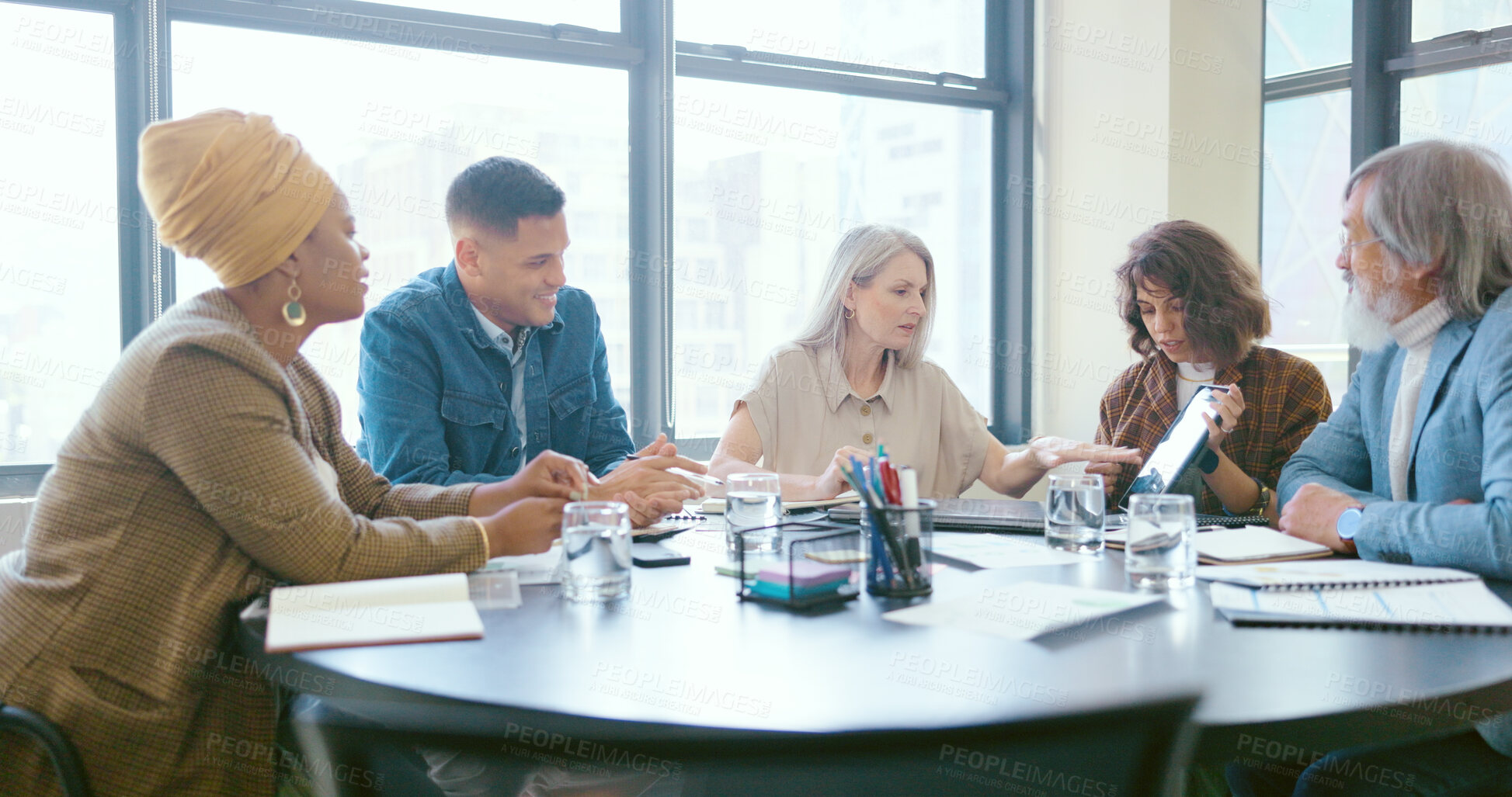 Buy stock photo Business, diversity and reading report in meeting with team planning, strategy and ideas in modern office for goals or target. Group, discussion and people with tech for market research in New York