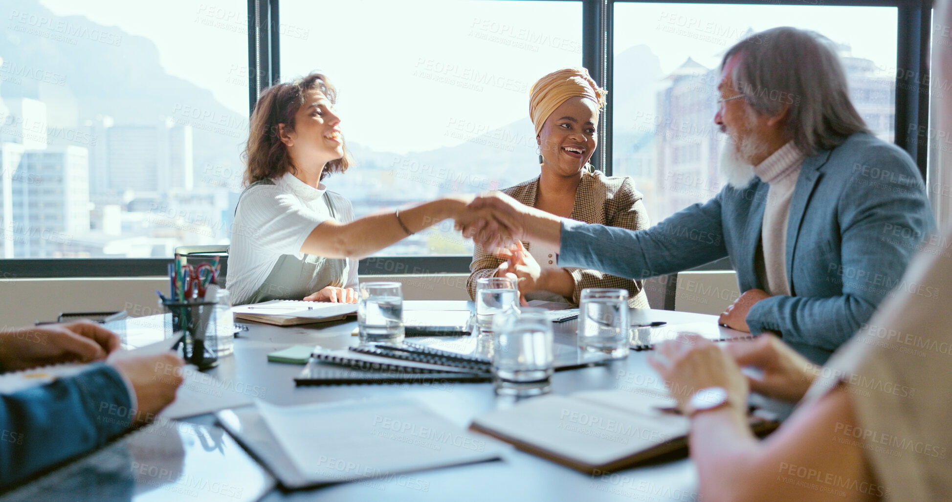 Buy stock photo Handshake, business people at meeting and teamwork in conference room with partnership and contract. Marketing research, planning and shaking hands at startup with collaboration and diversity