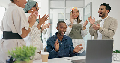 Success, applause and black man with proposal in office at startup business with proud team. Congratulations, cheering and support for winner target achievement with employees clapping hands at desk.
