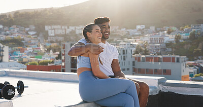 Buy stock photo Fitness, couple and city to rest for exercise, workout or training together on a building rooftop. Happy man and woman on sports outdoor break with smile, communication or conversation in Cape Town