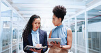 Mentor, discussion and business women walking in office workplace. Leadership, coaching and group of people or employees in hallway talking, planning or brainstorming project with tablet and books.