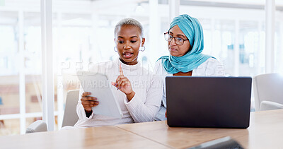 Business, women and explain with laptop, documents or update planning schedule, modern office or advertising agency. Coworkers, black female or Muslim lady speaking, brainstorming or confirm deadline