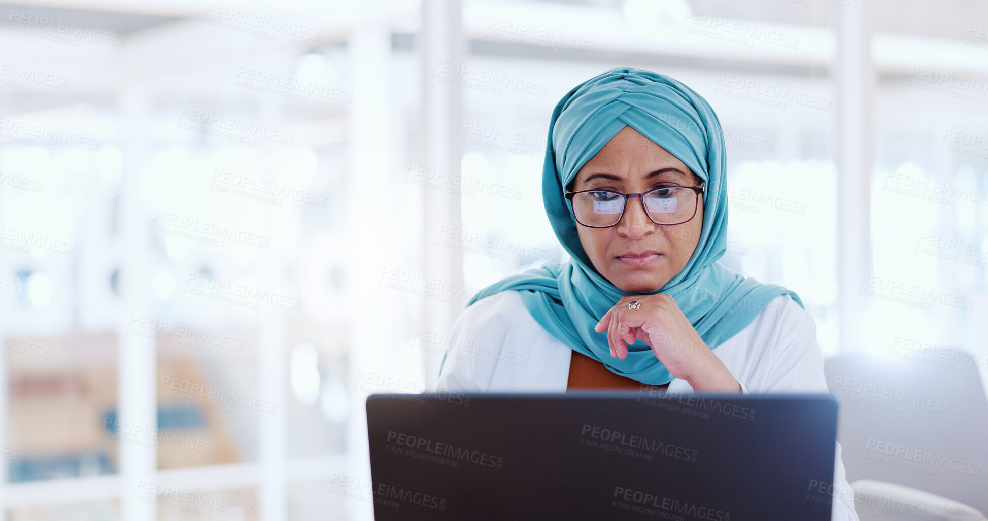 Buy stock photo Thinking, business and Islamic woman with a laptop, research or online reading with email, budget planning or network. Muslim person, financial adviser or investor with pc, serious or problem solving