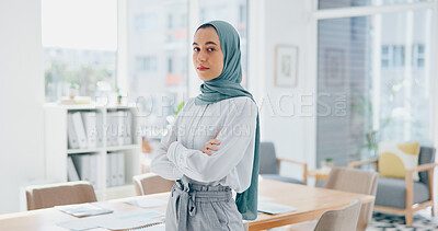 Muslim executive, woman and face with arms crossed in office for vision, success and goal in web design startup. Islamic business leader, mission and focus with goals, dream and innovation in Dubai
