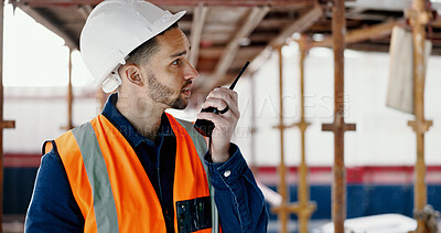 Logistics worker, walkie talkie and man on a construction site working on a building project. Architecture, communication and engineer talking on a radio while doing home maintenance or renovation.