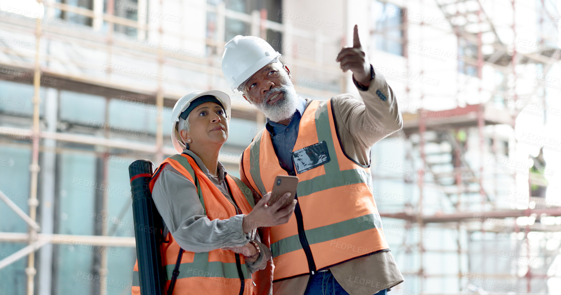 Buy stock photo Phone, discussion and engineering team on construction site outdoor for maintenance, repairs or inspection. Collaboration, industry and engineer contractors working on industrial development project.