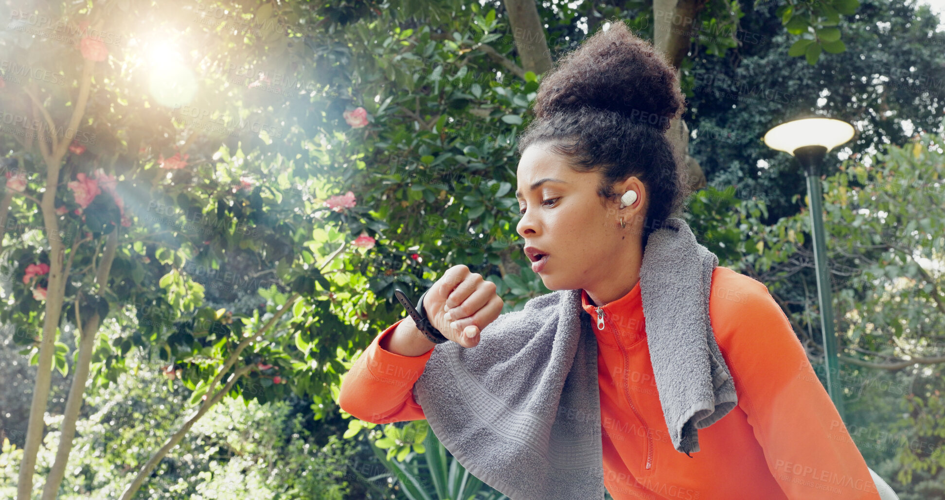 Buy stock photo Fitness, time and a tired woman runner outdoor in the park for a workout routine in summer. Exercise, health and watch for sports tracking with a young athlete taking a break while cardio training