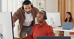 Call center, customer service and man training black woman in office. Coaching, learning and teamwork of telemarketing consultants, sales agents and male helping female intern with computer software.