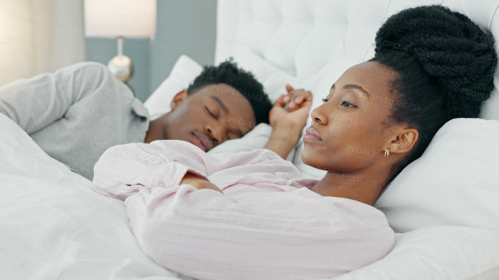 Buy stock photo Insomnia, couple and black woman in bed frustrated by snoring, crisis or sleep apnea at home. Sleeping, conflict and angry female with stress, anxiety or divorce depression, liar or bedroom problem