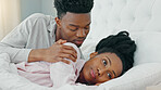 Relationship problems, upset and unhappy woman ignoring man after arguing, cheating or pms while lying in bed. Black couple feeling sad or depressed about marriage or relationship issues or trouble