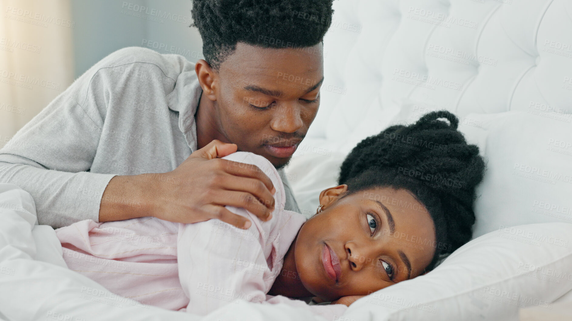 Buy stock photo Angry, sorry or apology with a black couple in bed together in a home after a fight or argument. Divorce, breakup or marriage problems with a frustrated woman and man in the bedroom during conflict