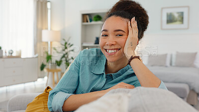 Woman, sofa and face with smile, thinking and happy idea in home, living room or apartment. Black woman, couch and relax in lounge, house and daydream with vision, goal or happiness in Los Angeles