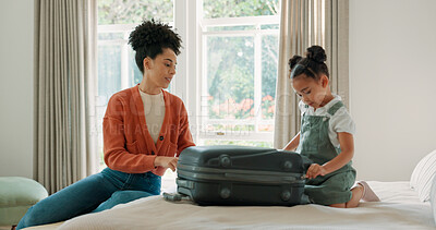 Travel, luggage and mom packing with child in bedroom getting ready for trip. Helping hands, black family and young girl help mother pack clothes in suitcase for holiday, vacation and weekend away