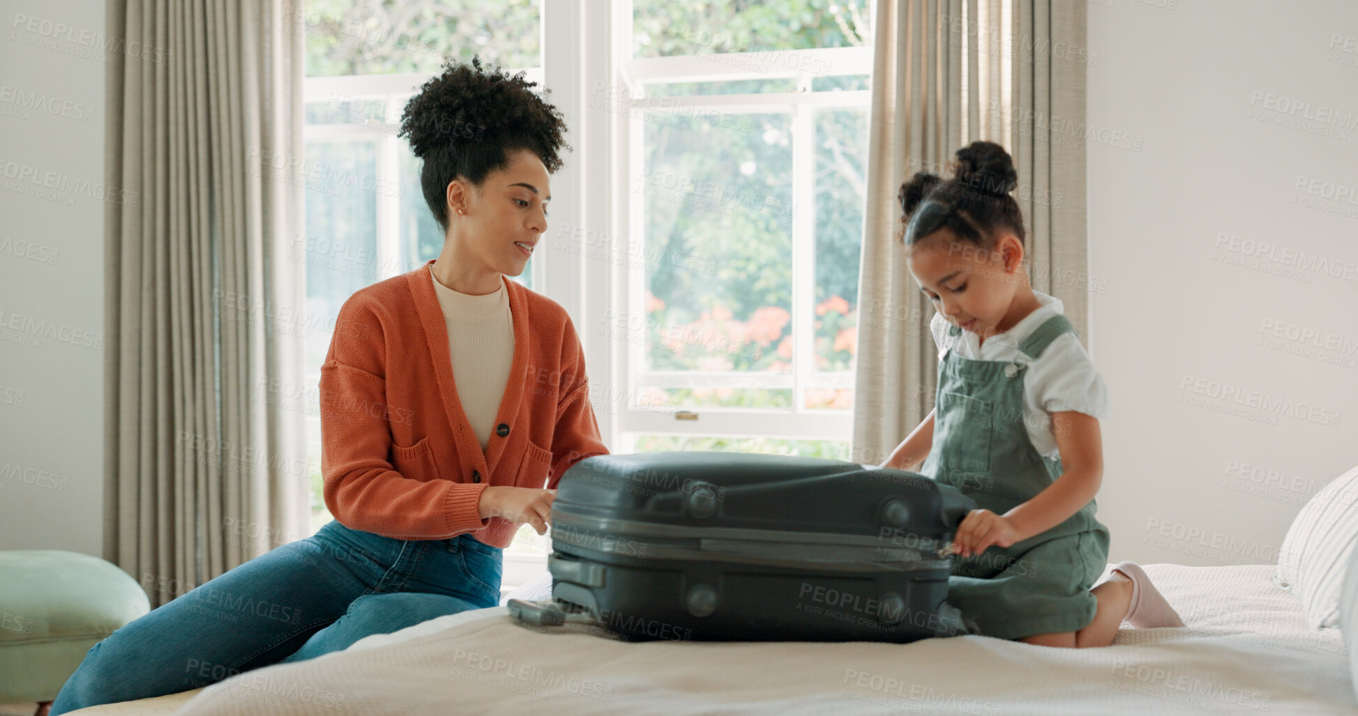 Buy stock photo Mother, child and suitcase for travel in home bedroom together and ready for family vacation trip. African woman or parent and girl kid relax on hotel bed with clothes or luggage for holiday getaway