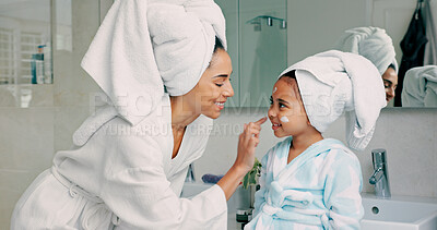 Home spa, mother and child doing morning beauty cleaning with family product for dermatology, cosmetic and skincare. Black woman and girl happy for wellness, health and skin cream or mask in bathroom