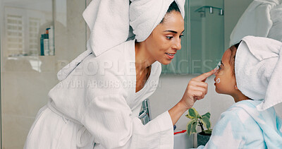 Home spa, mother and child doing morning beauty cleaning with family product for dermatology, cosmetic and skincare. Black woman and girl happy for wellness, health and skin cream or mask in bathroom