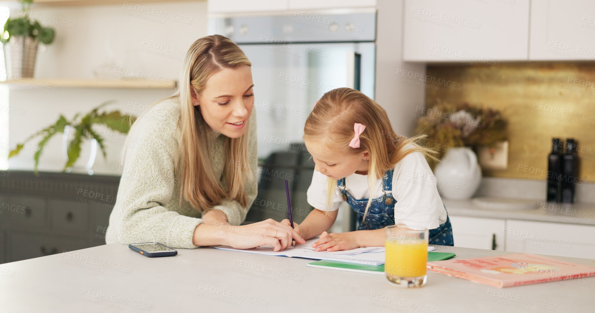 Buy stock photo Education, homeschool and mom with child writing, teaching and learning, development and help with homework. Home study, happy mother and girl with kindergarten project in notebook on kitchen counter