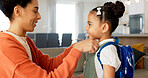 Little girl kissing her mother. Young mother hugging her daughter. Loving mother hugging daughter before school outside. Little girl going to school. Happy woman embracing daughter