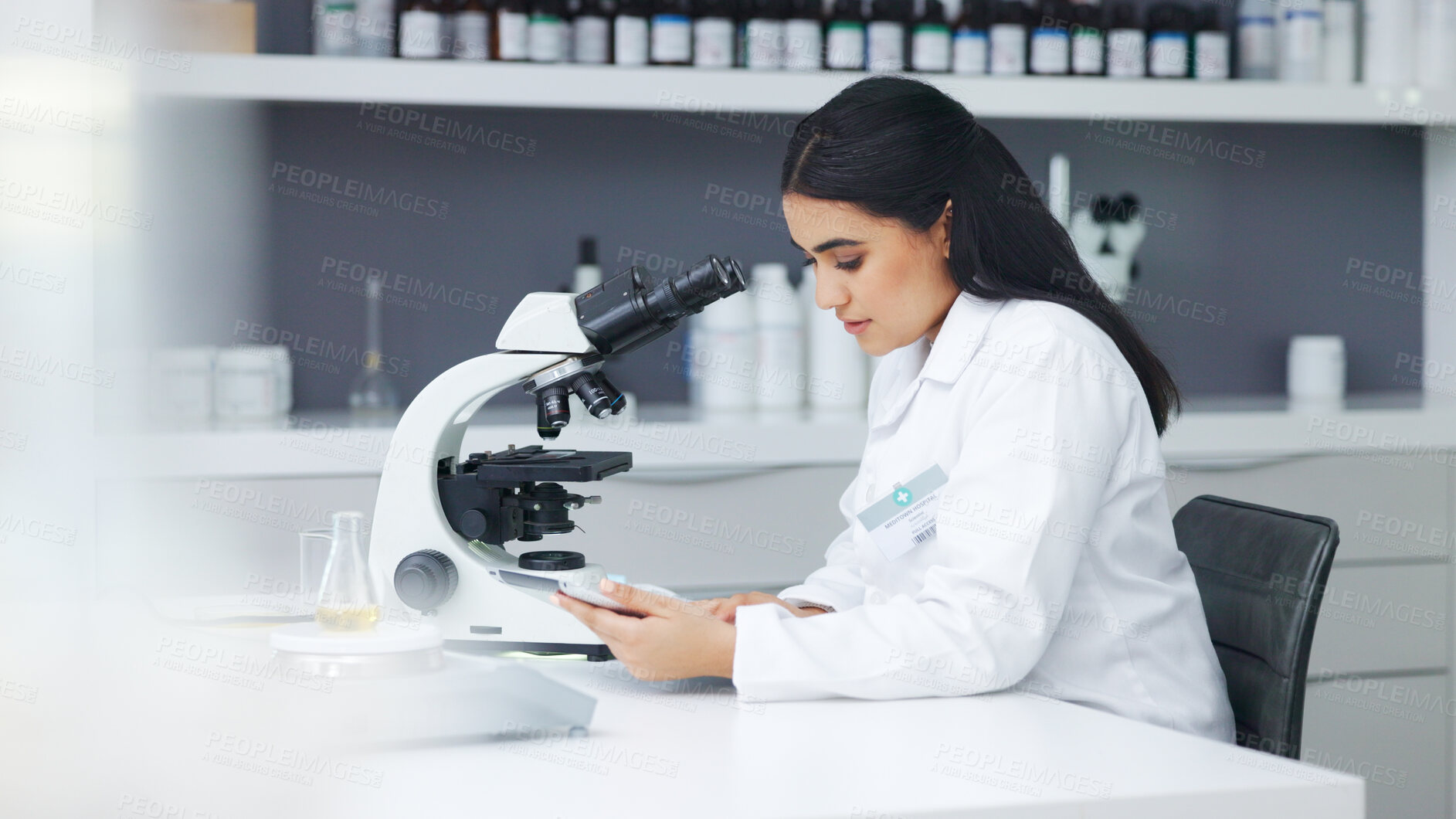 Buy stock photo Medical science, laboratory and a woman with a microscope for experiment and study. Young scientist, biology or biotechnology person analyzing sample for research and development in medicine