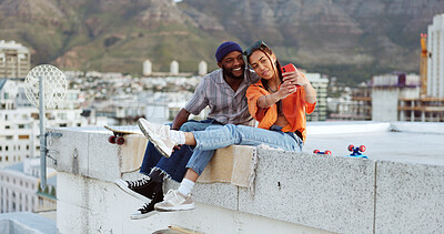 Selfie, rooftop and couple with skateboard and smartphone for social media post, social network update or gen z lifestyle blog with urban cityscape. Influencer black people friends in phone portrait