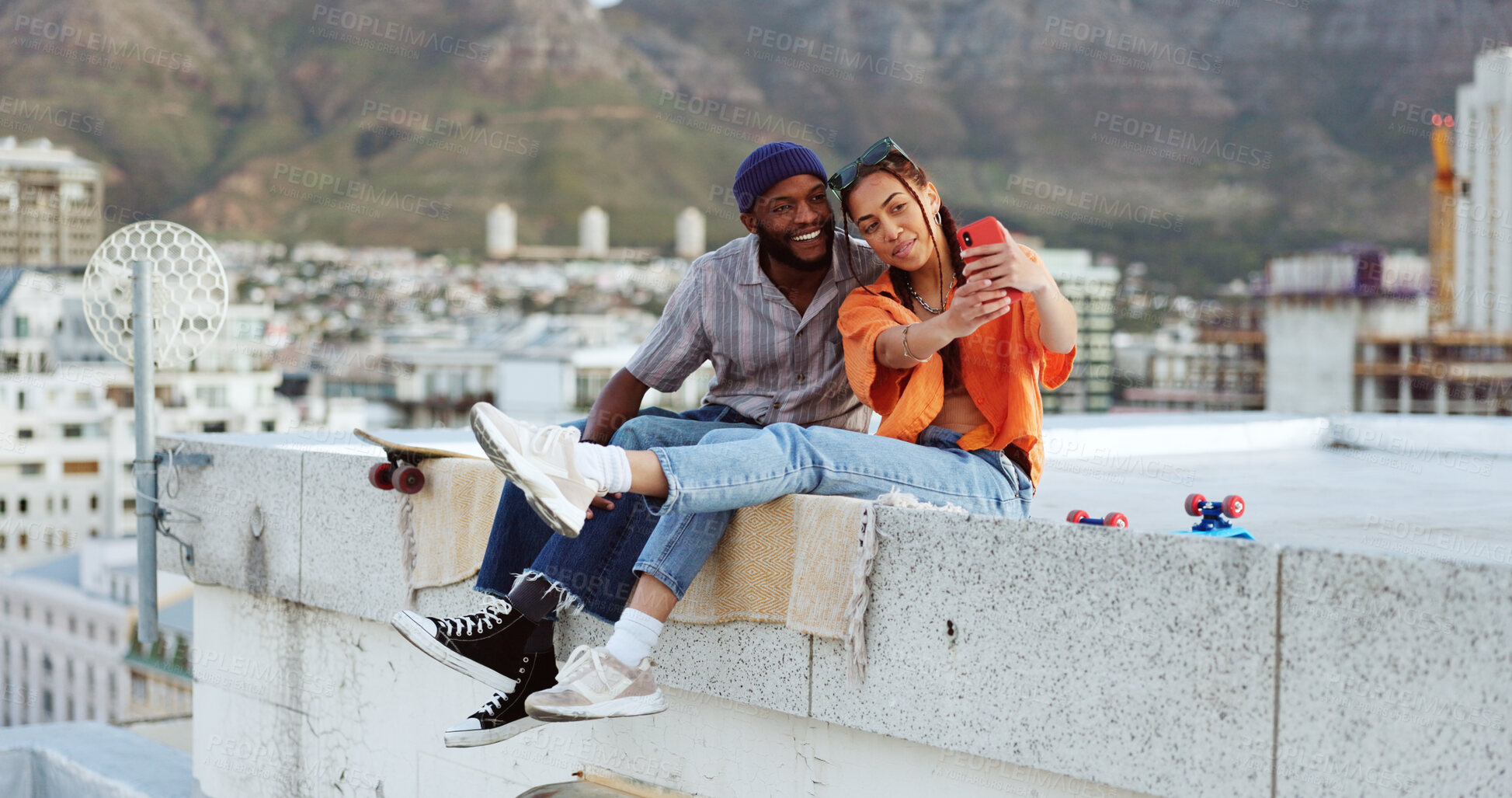 Buy stock photo Selfie, man and woman on roof in city, smile and youth in happy social bonding together. Photography, gen z couple of friends and rooftop skatepark, love and relax on urban date with skate influencer