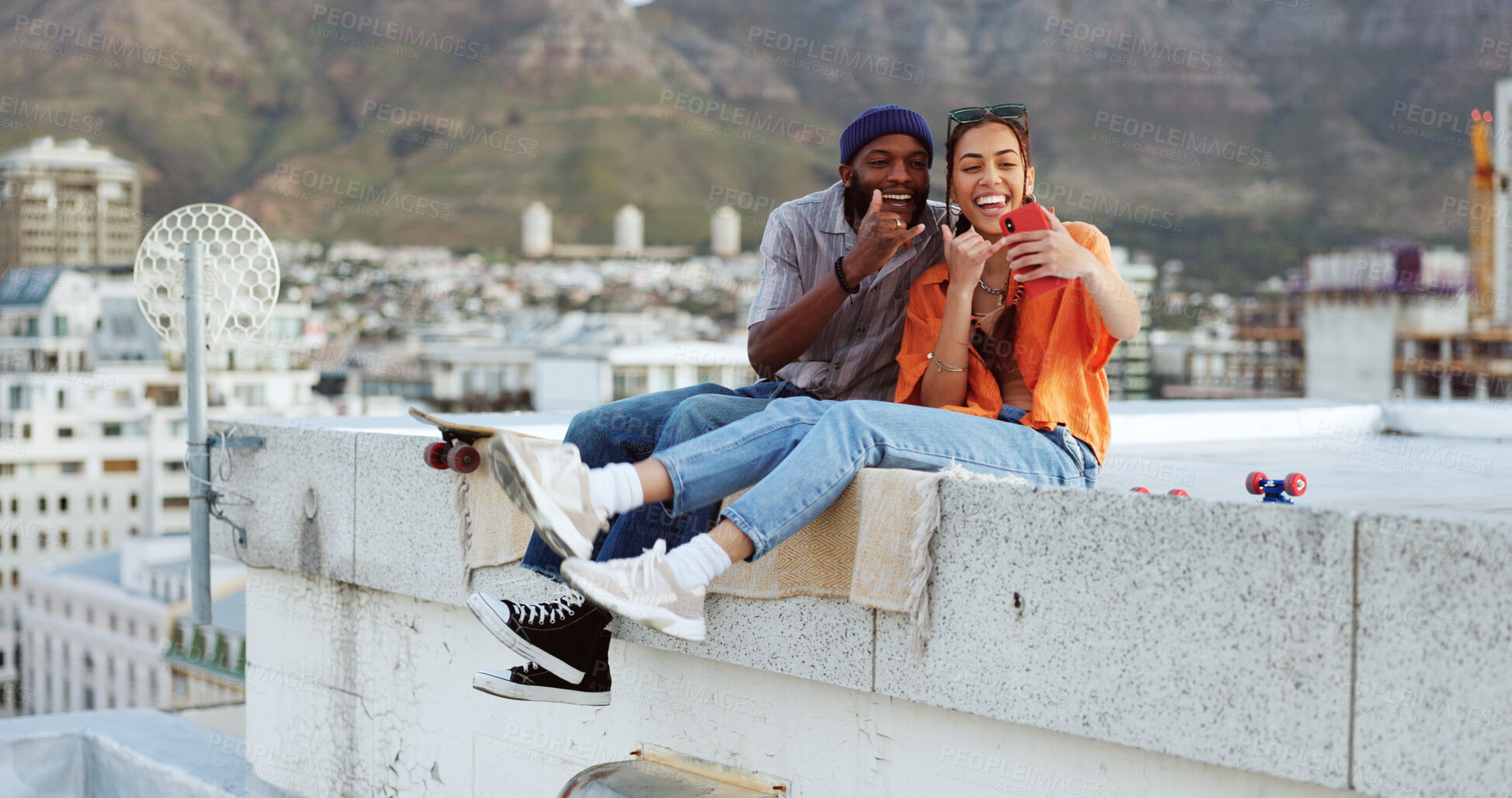 Buy stock photo Selfie, couple of friends on roof in city with smile and youth in happy social bonding together. Photography, gen z man and influencer woman at rooftop skate park, shaka emoji and relax on urban date