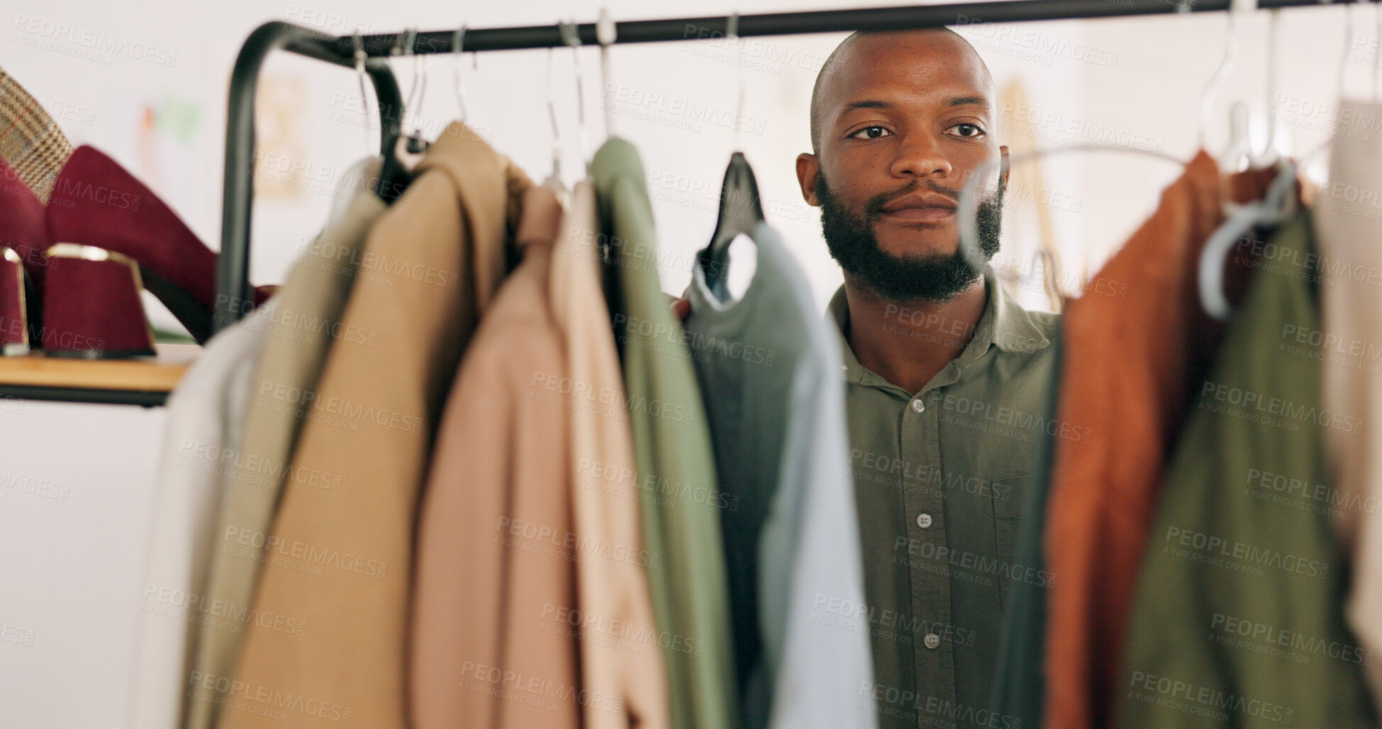 Buy stock photo Fashion, shopping and small business with black man, store and warehouse with product, wealth and payment. African person, customer and client with boutique clothes, expensive items and retail choice