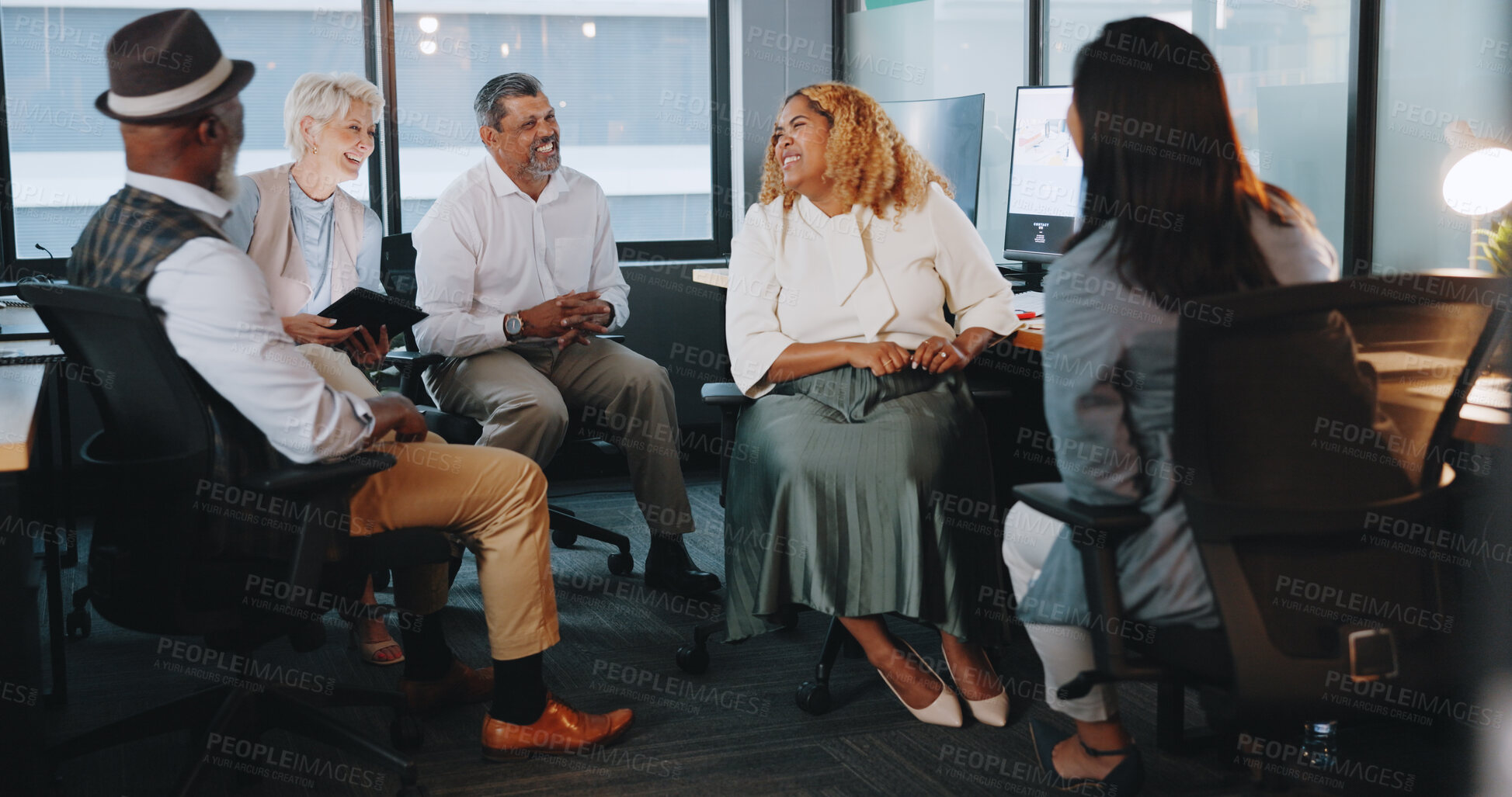 Buy stock photo Business people, teamwork and meeting at night for communication or collaboration together at office. Group of employees working late in team discussion, planning or project deadline at workplace