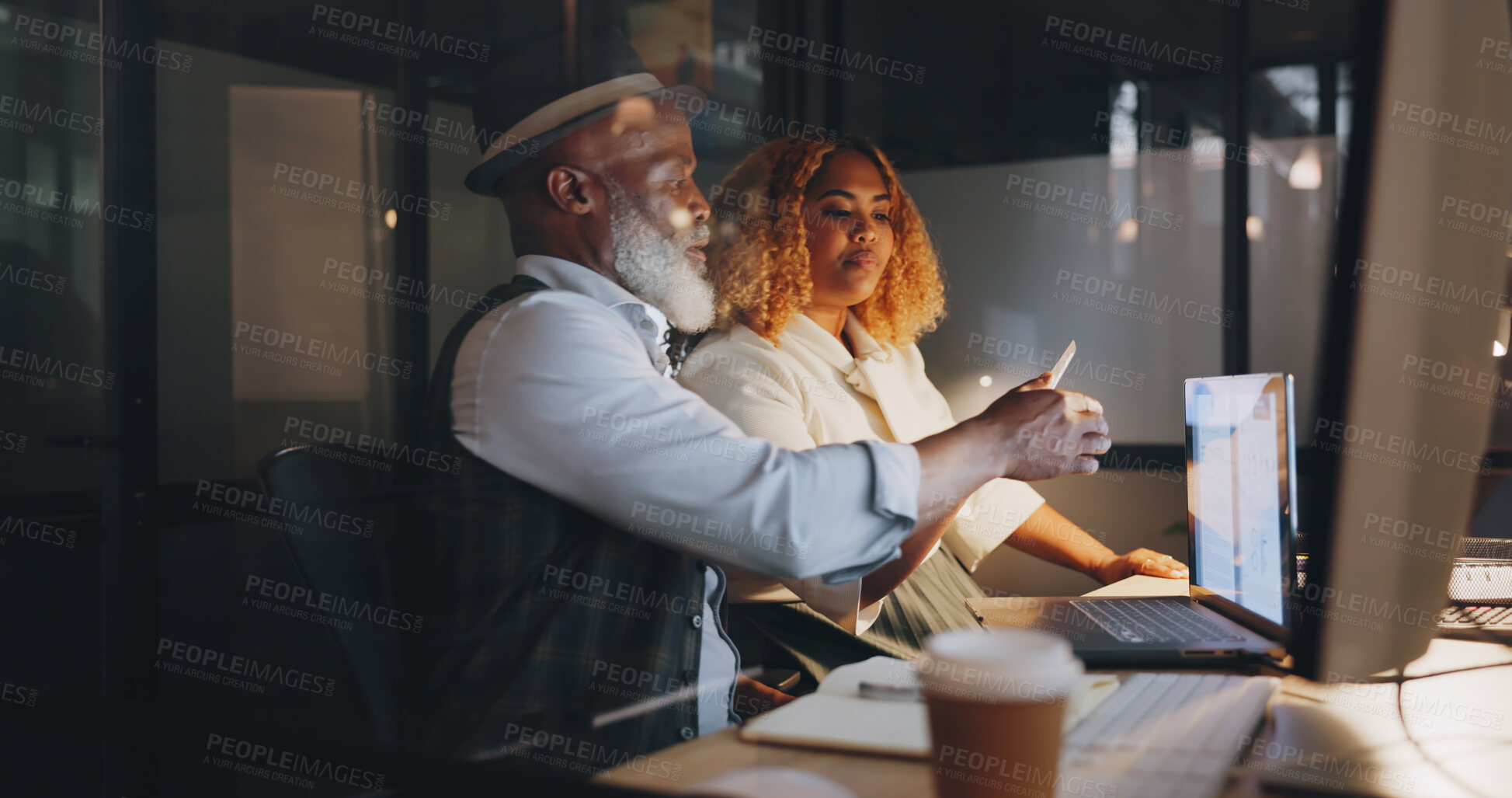 Buy stock photo Laptop, collaboration with a mentor coaching a colleague in the office at night for training on the company vision. Computer, teamwork or partnership with a man and woman employee in the workplace