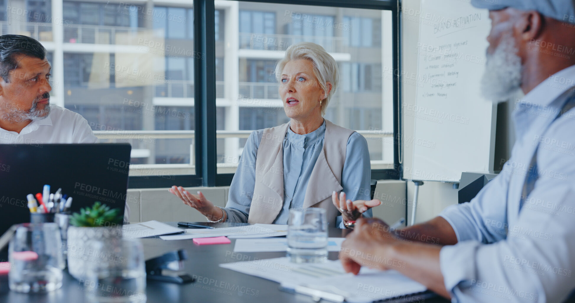 Buy stock photo Senior woman, manager and teamwork in a meeting, brainstorming and conversation with collaboration, support and documents. Mature person, employees and group with paperwork, support and cooperation