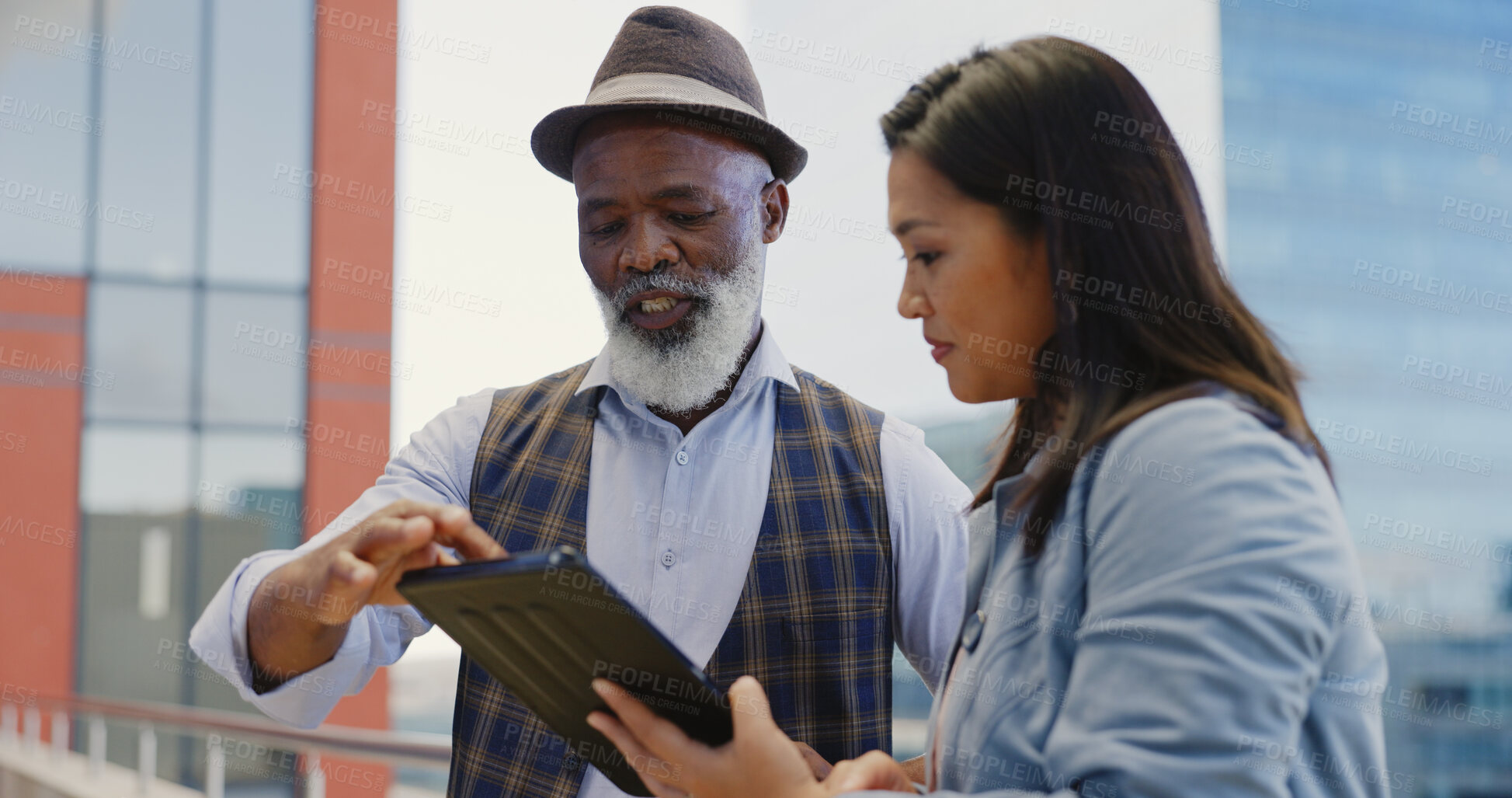 Buy stock photo Business, people and discuss with tablet on rooftop for planning, strategy or feedback of vision. Diverse group, ceo and employee in meeting for research, management or digital marketing of project

