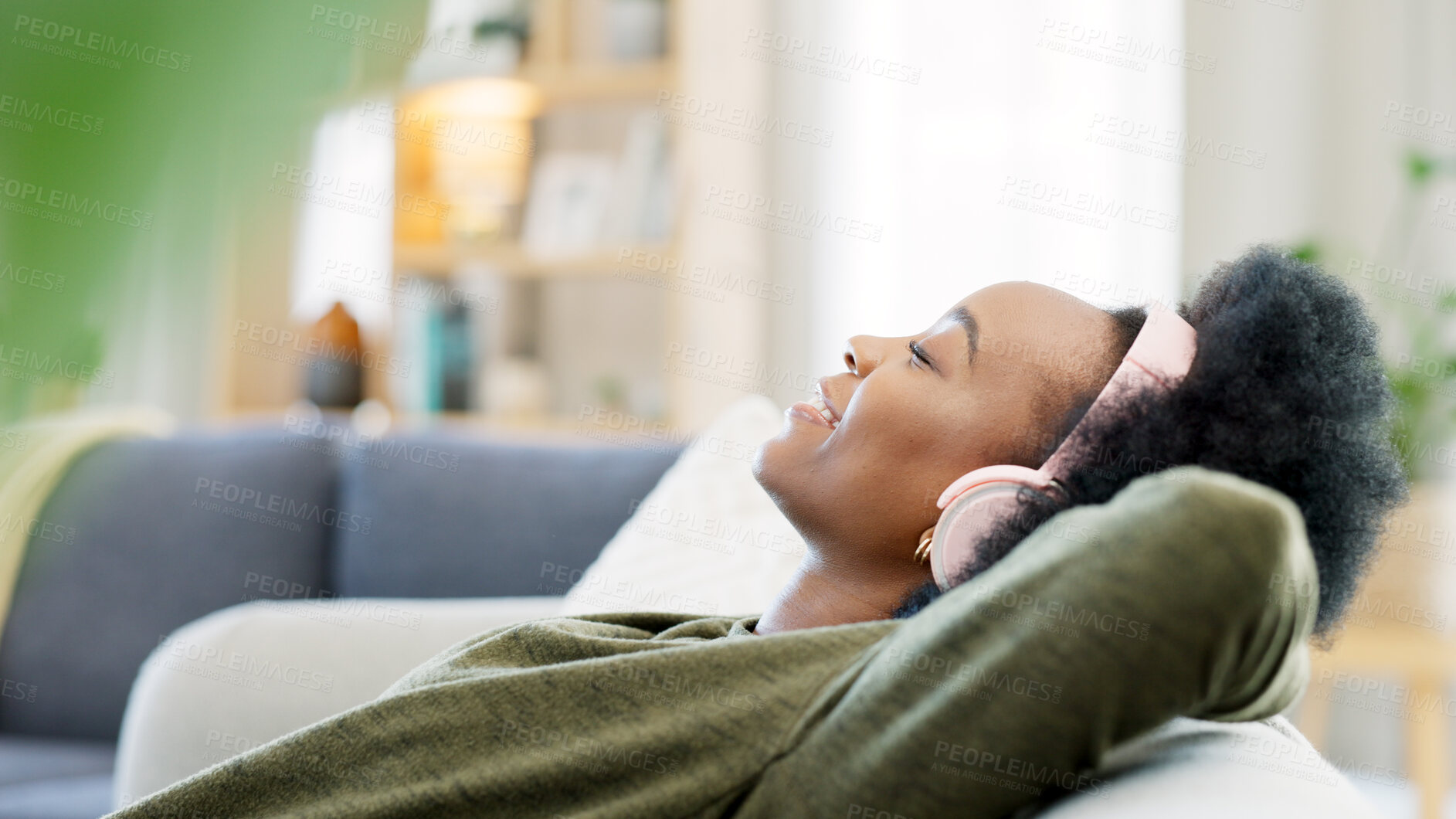 Buy stock photo Woman, music and headphones in home for listening to audio, radio and hearing podcast for sleep on sofa. Happy african person relax for streaming sound, multimedia and peaceful subscription in lounge