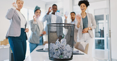 Office, trash and business people throw paper as a competition, game or challenge together. Happy, diversity and excited corporate team playing with with supplies in a bin for fun in the workplace.