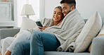 Happy, couple with phone for communication, networking or social media app at home. Movie, video or love man and woman relax in living room streaming online, internet or website with smile in house