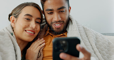 Happy, couple with phone for communication, networking or social media app at home. Movie, video or love man and woman relax in living room streaming online, internet or website with smile in house