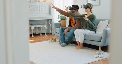 VR gamer couple, metaverse or futuristic tech on sofa in living room for cyber game, 3D gaming or future ai media. Virtual reality, video game or esports for technology, digital fun or online fantasy