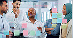 Meeting, collaboration and sticky notes on glass with a business black woman coaching her team in the office. Strategy, teamwork and planning with a creative man and woman employee group at work