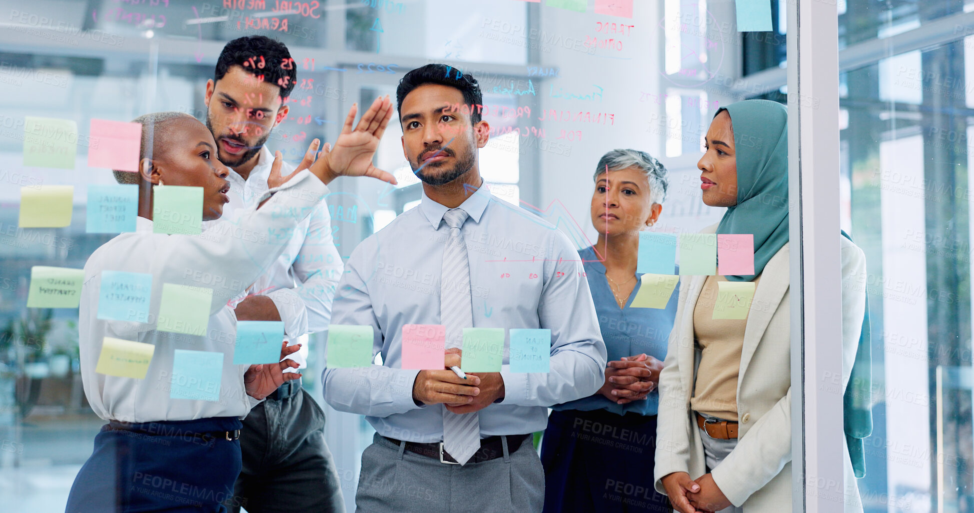 Buy stock photo Collaboration, meeting and sticky note with a business man training a team, planning or strategy on glass in office. Scrum, diversity and discussion with men and women employee group at workshop