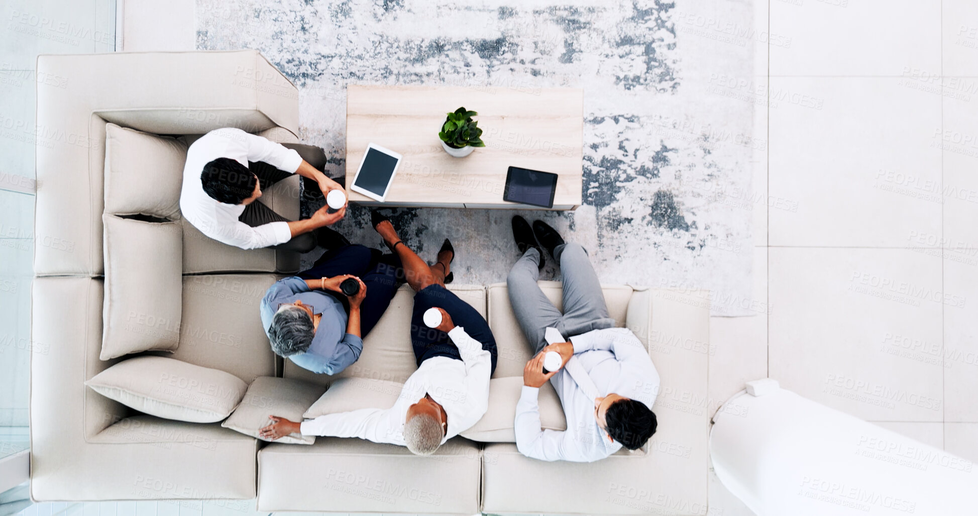 Buy stock photo Business people, meeting and break in lounge at office for relax, collaboration or team building above. Top view of employees in social discussion, idea or collaboration on sofa together at workplace