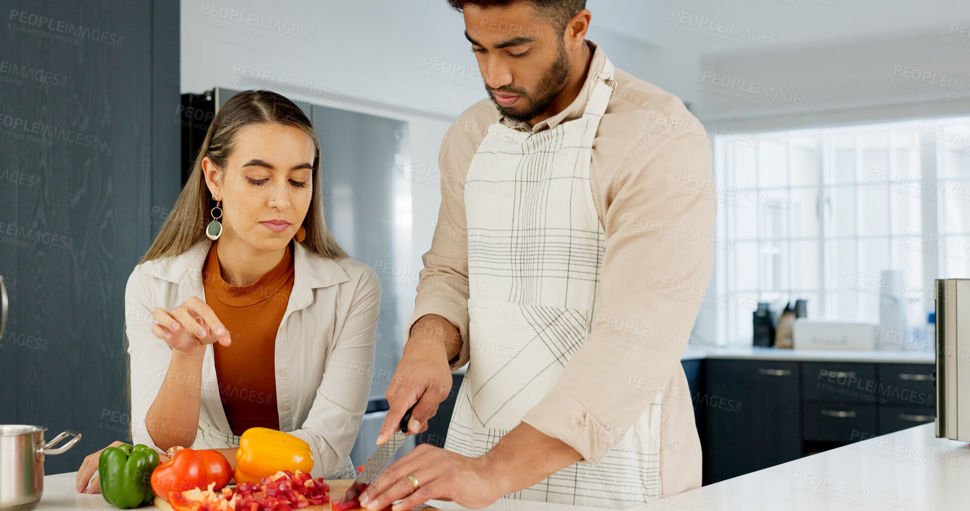 Buy stock photo Cooking, couple and together in kitchen and learning for relationship growth and bonding, skill development and support. Young man, woman and cook Italian food, help and advice, spending quality time