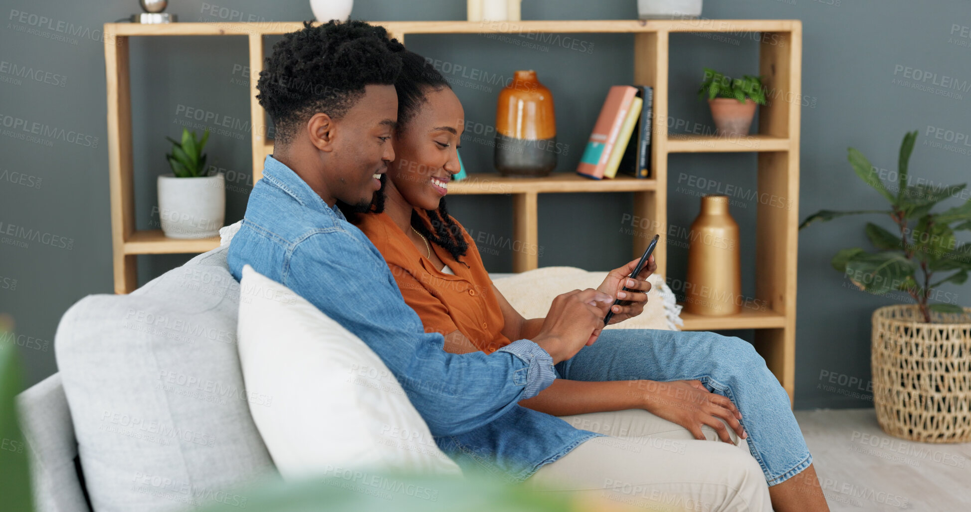 Buy stock photo Internet, technology and couple with phone on sofa in living room. Black man, young woman and a banking app, online shopping or social media on a mobile on a couch at home for communication and relax