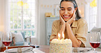 Couple, birthday and cake with kiss, blowing candles and hug, smile and clapping at a party in home. Happy latino man and woman with celebration, surprise and gift with romance, love and happiness