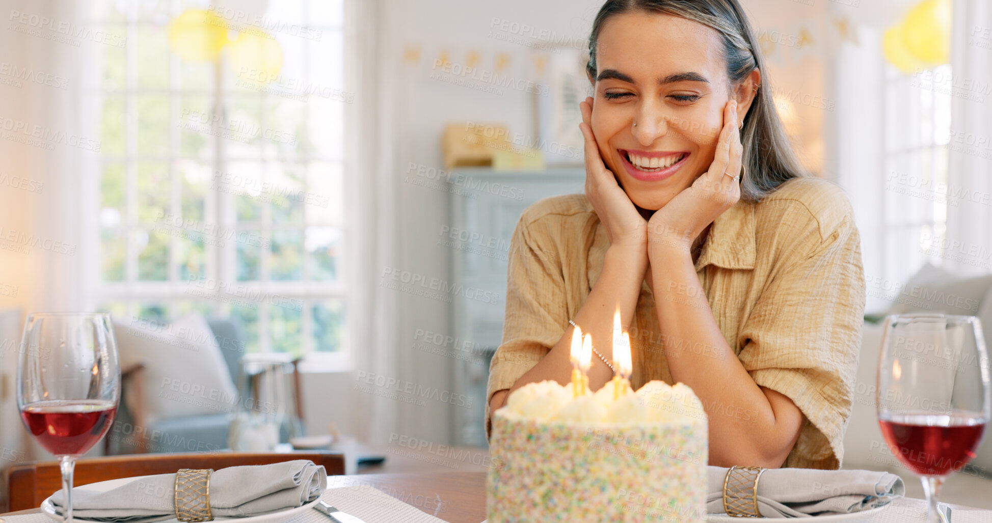 Buy stock photo Woman, birthday cake and smile in home for celebration or cheerful party event, surprise or happiness. Female person, dessert food with candles and excitement for good times, present in living room