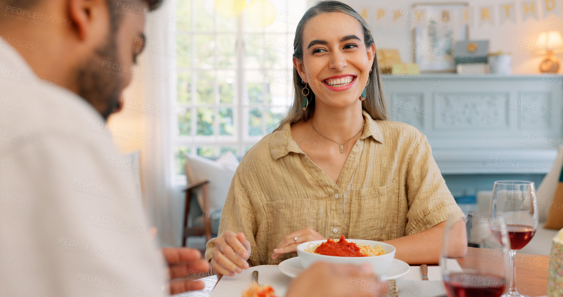 Buy stock photo Birthday cake, funny joke and couple with spaghetti on a romantic dinner home with Italian meal together. Love, man and woman on date with pasta, laughing and anniversary with celebration at table