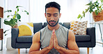 Meditation exercise, man yoga training and zen workout for spiritual health, relax for wellness and prayer hands for health in living room. Calm, healthy and Asian person praying for motivation