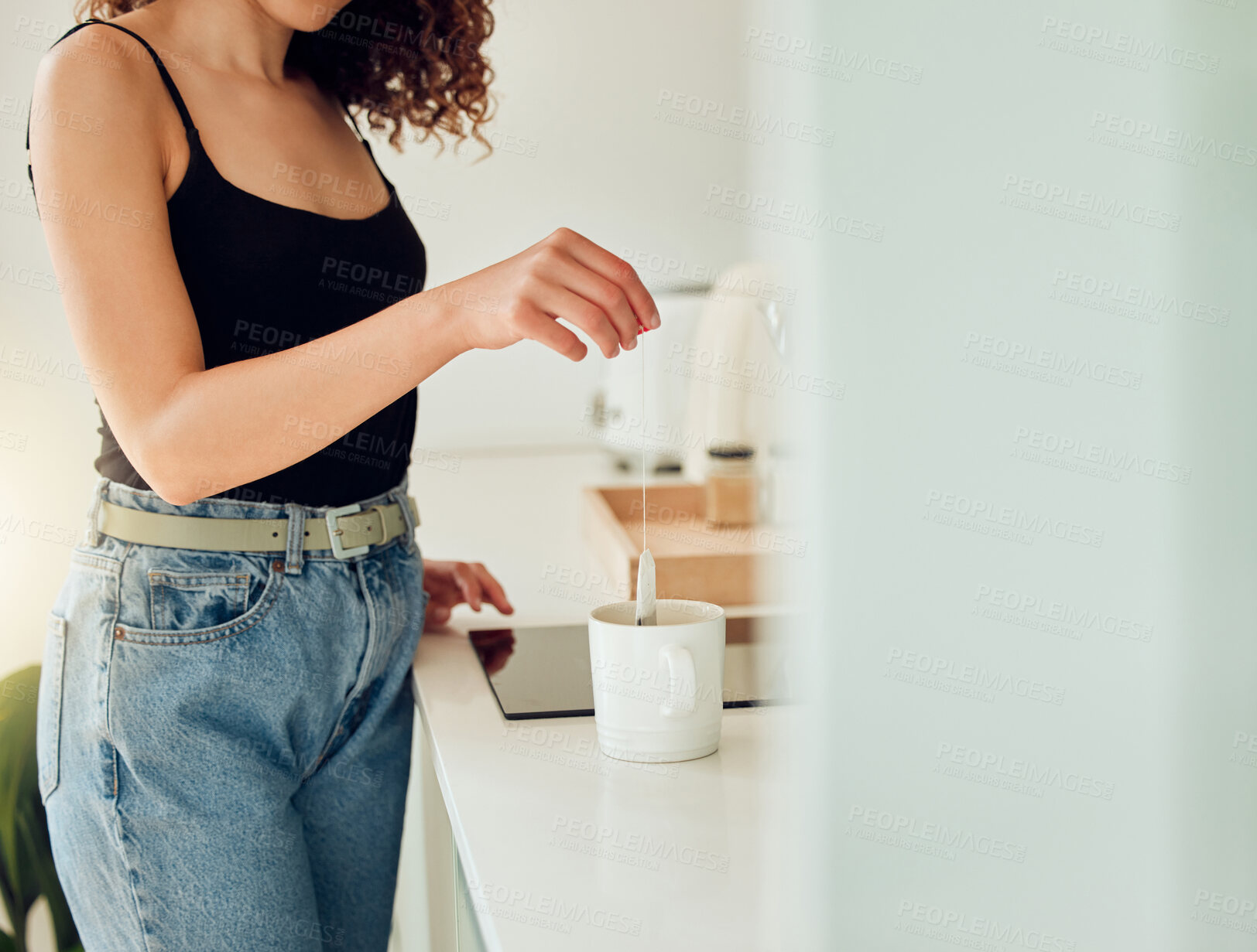 Buy stock photo Woman hand holding herbal tea bag over cup of boiling water, making chai in kitchen taking a break. Female barista woman working at cafe or coffee shop counter, hot drink during office lunch break. 