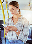 Travel, smartphone and woman on a bus or public transportation reading social media, online news or city website information. Young person with cellphone on train with lens flare for contact us