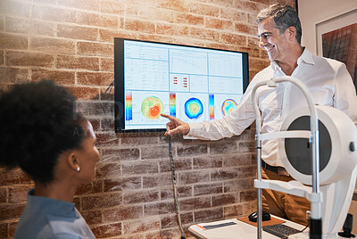 Buy stock photo Optometry, technology and optometrist explaining to a patient her eye test results in clinic. Healthcare, medical and man optician in discussion with woman on ophthalmology wellness in optical store.