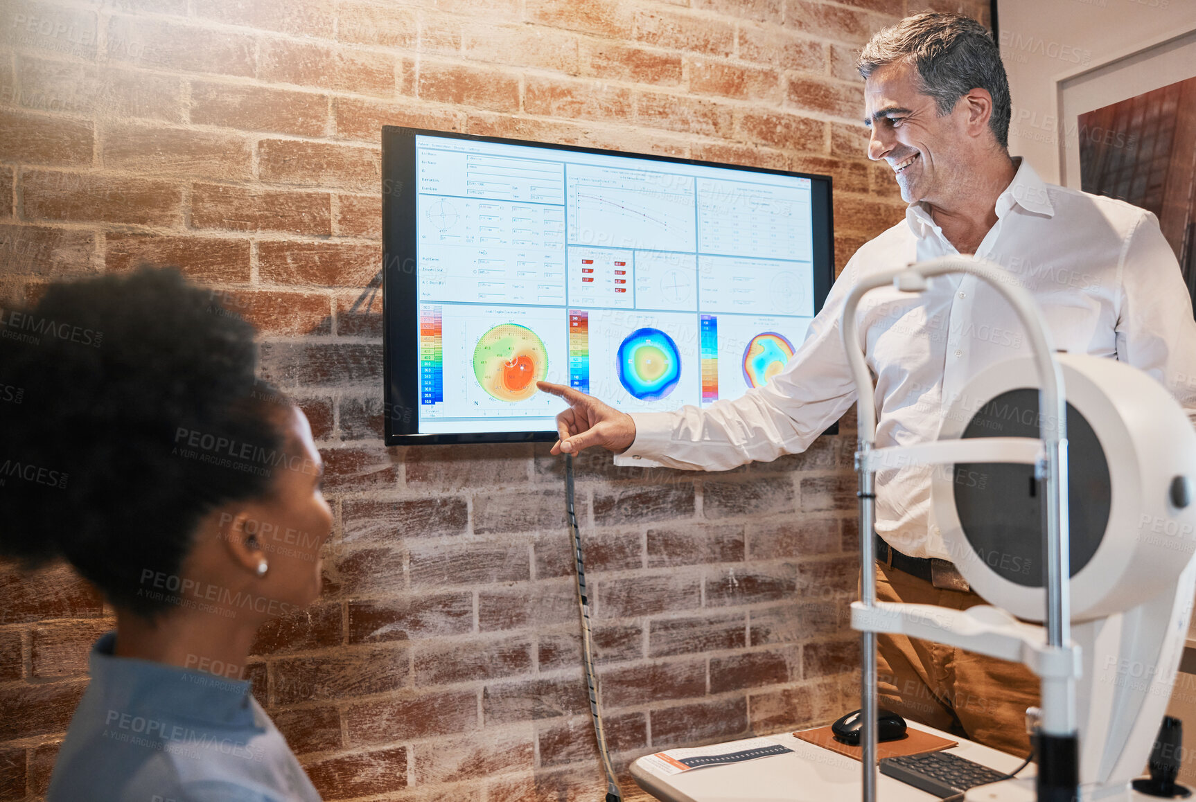 Buy stock photo Optometry, technology and optometrist explaining to a patient her eye test results in clinic. Healthcare, medical and man optician in discussion with woman on ophthalmology wellness in optical store.